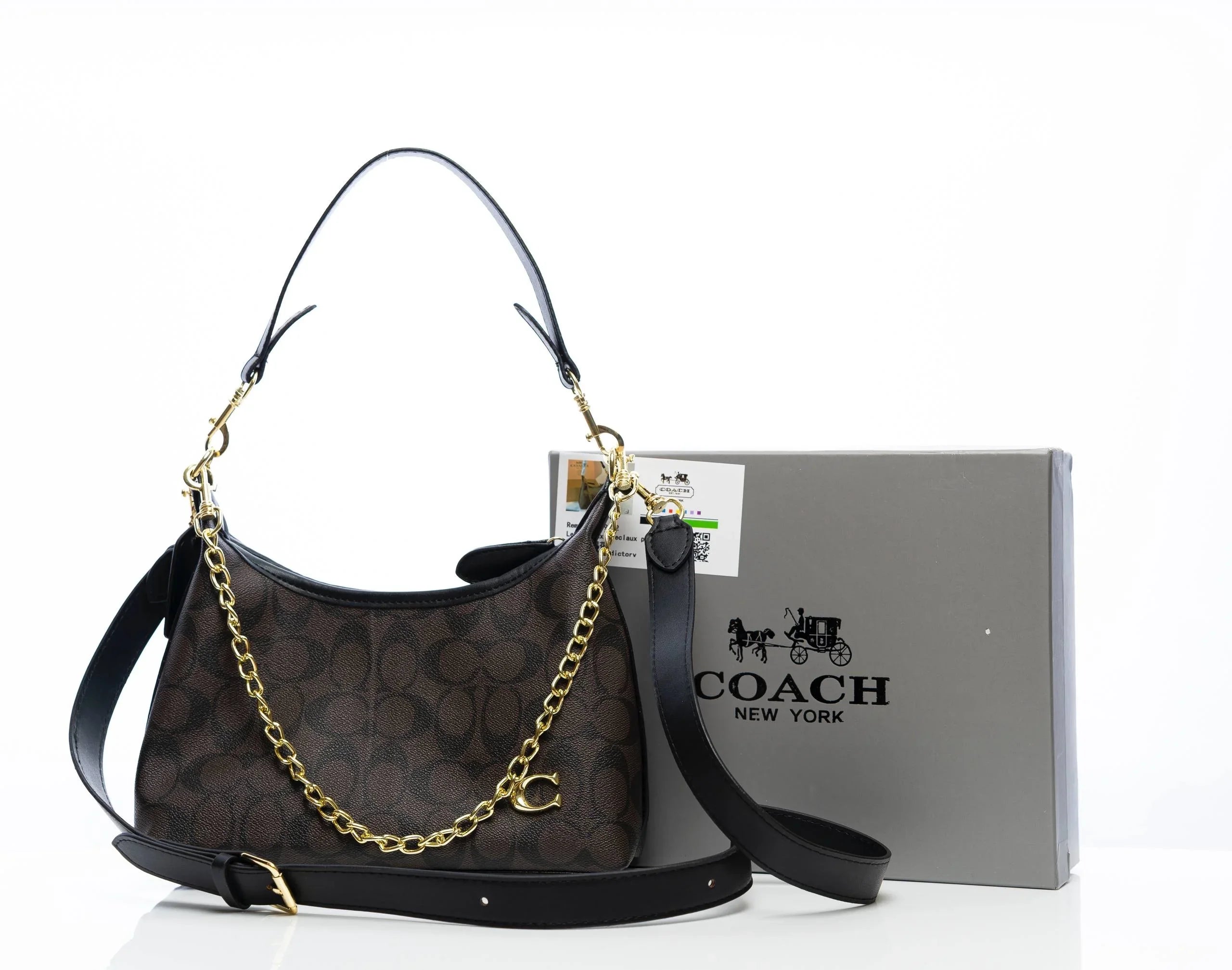 Brown designer shoulder bag with gold chain, black leather straps, and gift box