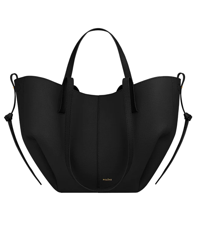 Black handbag with white accents on a white background